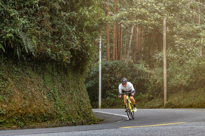 Racing to Victory: Cyclist Speeds Through the Road in a Thrilling Sprint