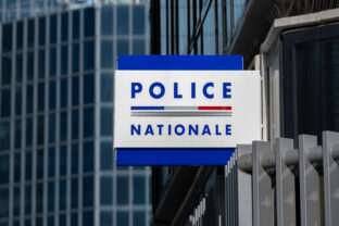 'POLICE NATIONALE' sign written in French on the facade of a police station in France