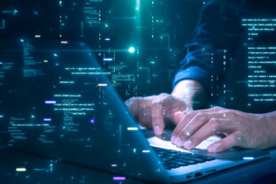 Close up of hands typing on a laptop with glowing programming code and binary graphics, symbolizing cybersecurity technology coding or software development.