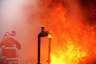 Gas pipeline leaks at the joints with the valve. Spark and Fire on the gas pipeline. An explosion at the gas pipeline.