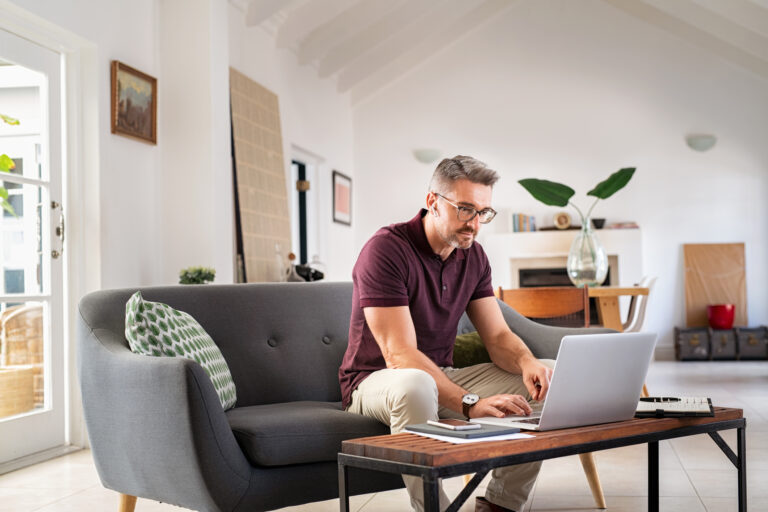 Mid adult business man working from home