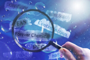 PFAS Forever Chemicals water and newspaper headlines with magnifying glass