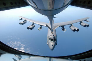 A KC 135 Stratotanker refuels a B 52 Stratofortress over the Indian Ocean.