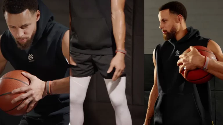 NBA hviezda Stephen Curry v Instagrame tease-ral textilný Fitbit náramok bez obrazovky (šedý/oranžový), ktorý mení váš vzťah k zdraviu. Konkurent Whoop/Oura s Premium funkciami – príchod koncom 2026.