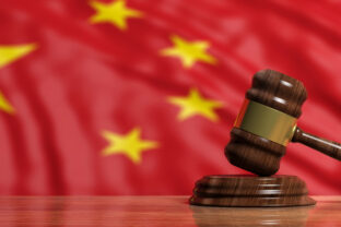 Judge or auction gavel on China flag background. 3d illustration