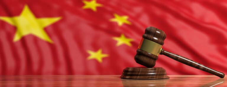 Judge or auction gavel on China flag background. 3d illustration