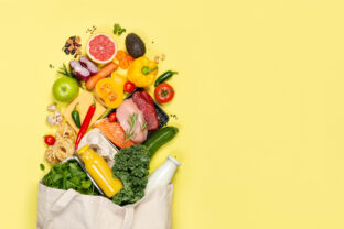 Grocery shopping concept - foods with shopping bag