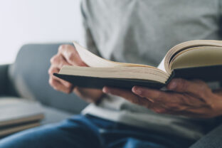 Man working or studying with book . Business and education concept