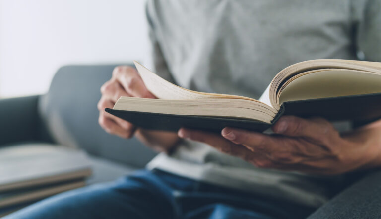 Man working or studying with book . Business and education concept