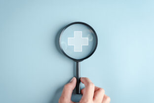 Health insurance concept. Hand people holding Magnifier focus to plus symbol and healthcare medical icon, health and access to welfare health concept.