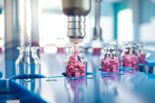 Jar filling with red tablets on a packaging line in a pharmaceutical factory - 3d illustration
