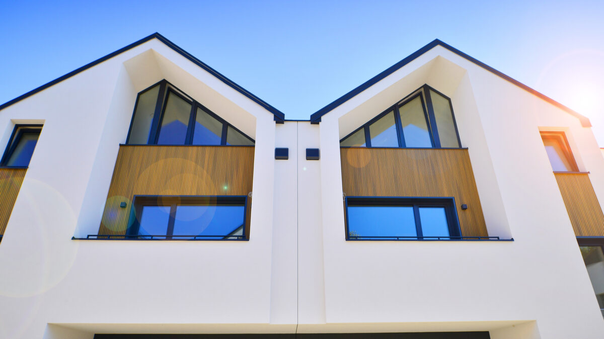 Residential homes with modern facade.Terraced family homes in newly developed housing estate.