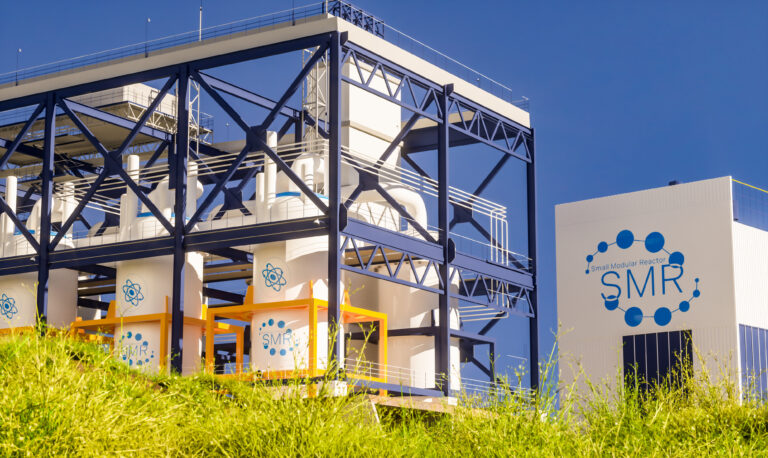 Concept of a SMR small modular nuclear reactor power plant on a sunny day. SMR is a future energy concept. 3d rendering.