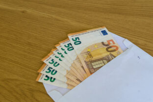 Partial View of Multiple 50 Euro Notes in a Plain Envelope