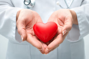 Doctor holding heart