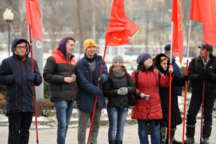 Truck drivers picket. Girls and boys with red flags