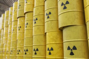 Dumping of radioactive waste barrels. 3D rendered illustration.