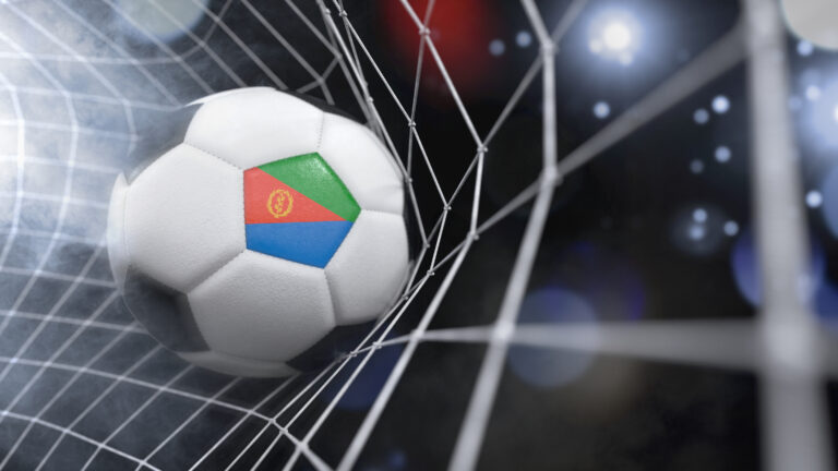 Realistic soccer ball in the net with the flag of Eritrea.(3D illustration series)