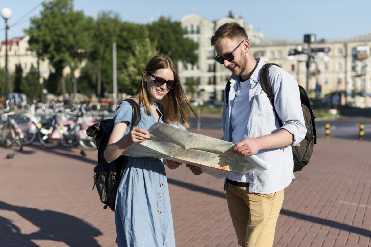 Tourist couple holding map together.jpg