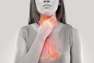 Woman Suffering From Acid Reflux Or Heartburn Isolated On White