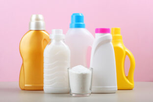 Bottles of laundry detergent on the table. Household chemicals