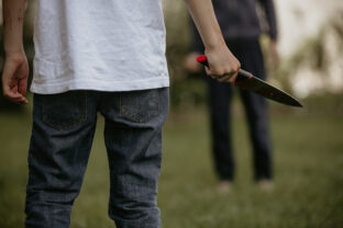 Teenager with knife, prepared for a crime
