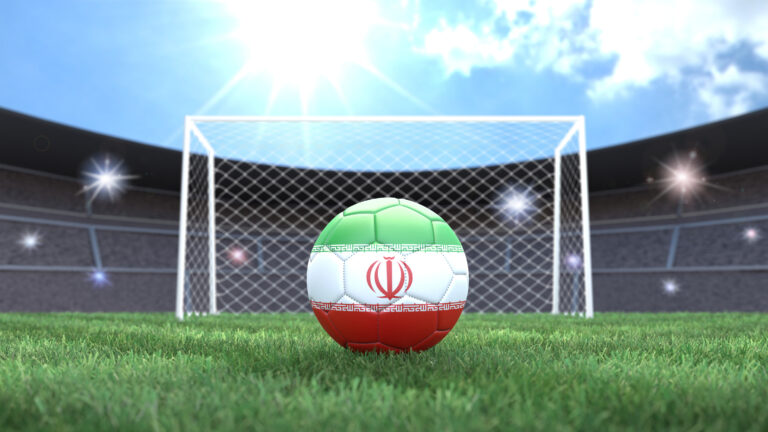 Soccer ball in flag colors on a bright sunny stadium background. Iran.