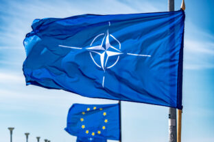 NATO flag waiving on a flagpole