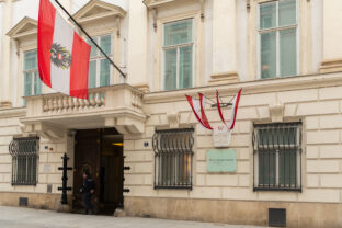Vienna, Austria. Entrance of Interior Ministry with Austrian flag and police presence