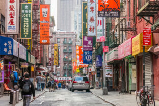 Tourists walks through Chinatown street, NY
