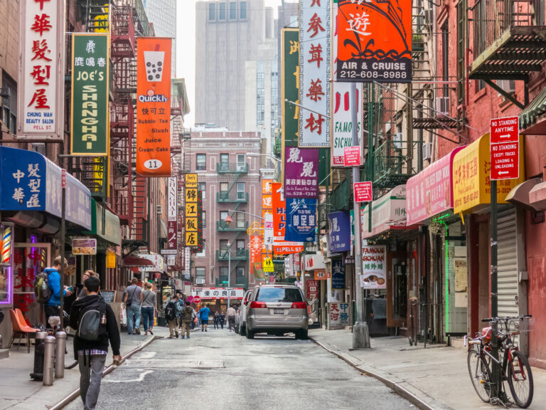 Tourists walks through Chinatown street, NY