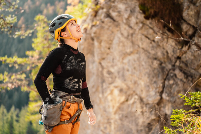 Climber wearing climbing equipment practicing rockclimbing rock mountain wall climbing sports bouldering concept rock climber climbs rocky wall.jpg