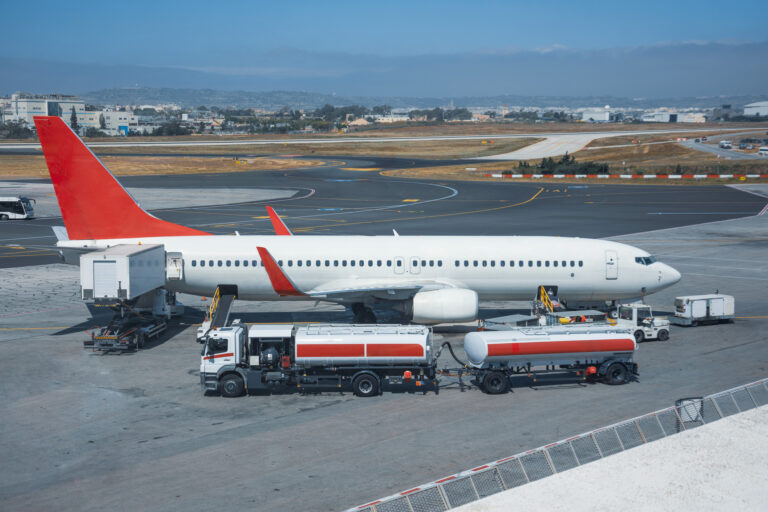 Truck with a tank and a trailer of aviation fuel during the refueling of the aircraft and its service before the flight.