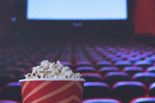 Pop corn and on red armchair cinema