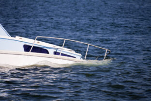 Sinking yacht bow in beautiful ocean water