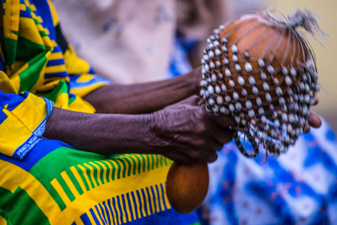 Man playing percussion in the Home of the Tabom People, in Accra (Ghana). Brazil house.