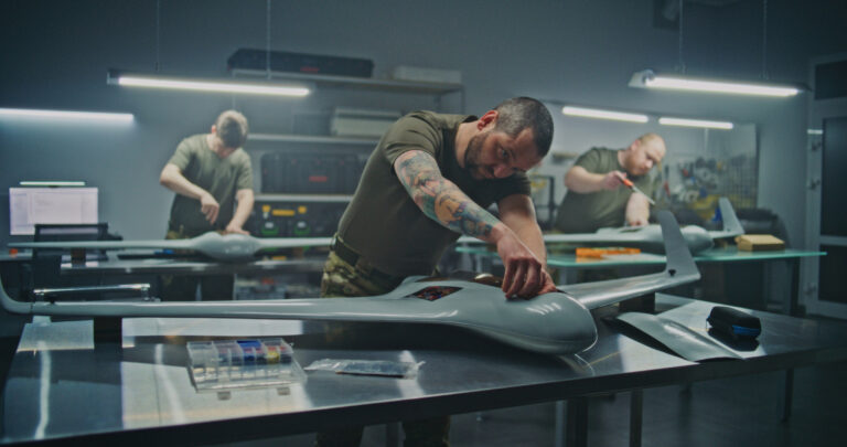 Concentrated Engineer Assembling Drone Internal Components