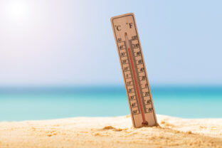 Close up Of Thermometer On Sand