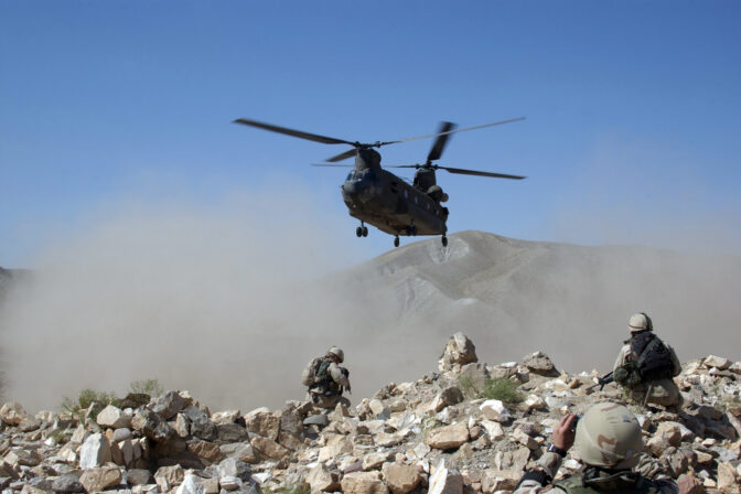 Clouds of dust kicked up by the rotor wash of a CH 47 Chinook helicopter in Afghanistan.