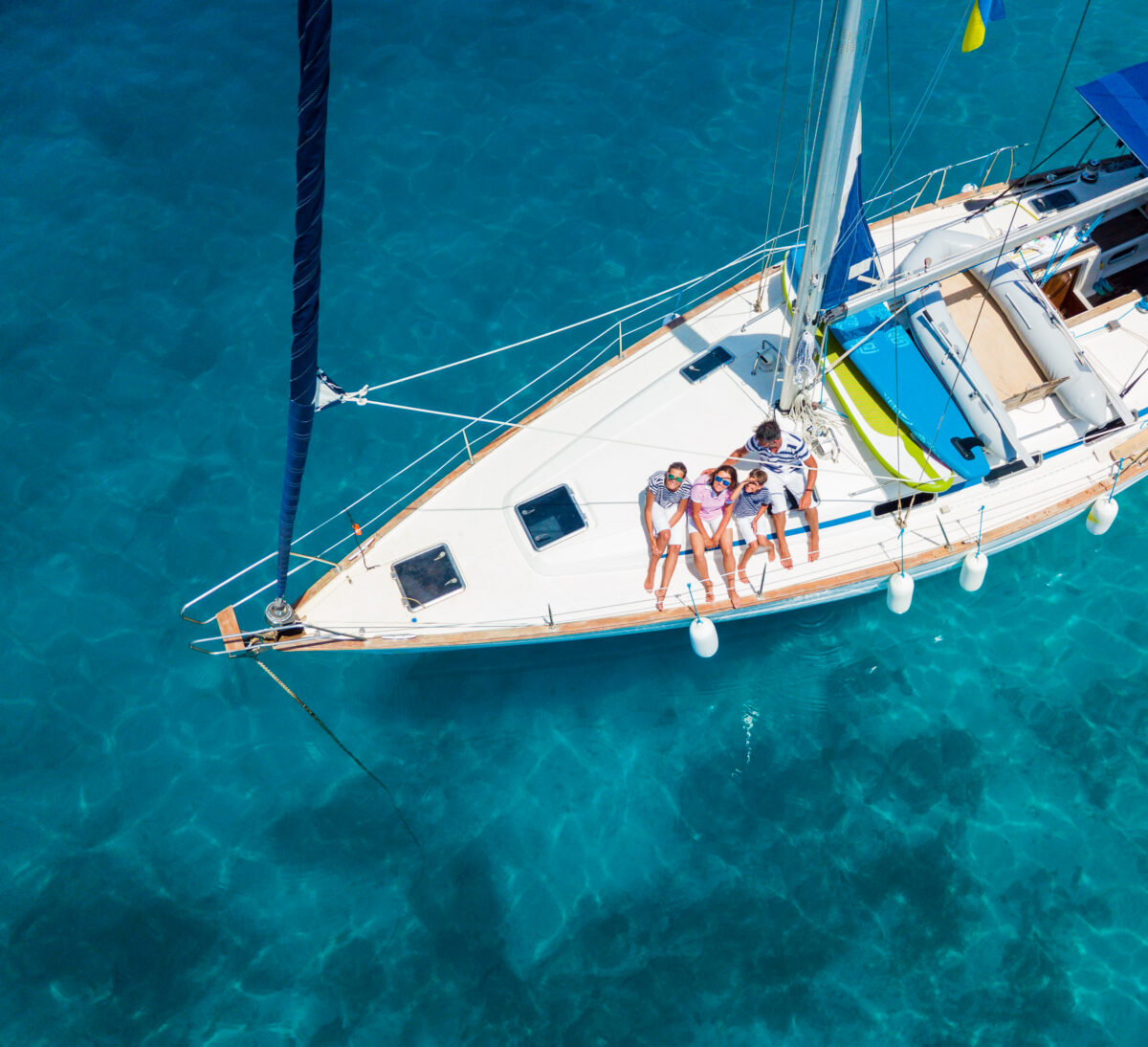 Top view of Family with adorable kids resting on yacht