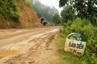 Road signs with mud and puddles