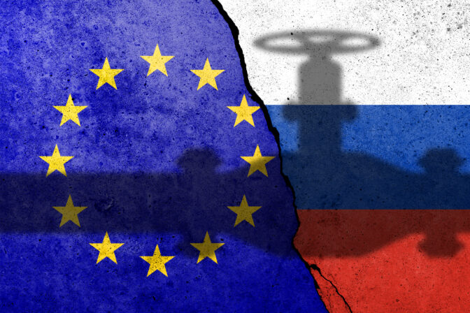 Flag of Europe Union and Russia painted on a concrete wall with gas pipe shadow. Relationship between EU and Russia