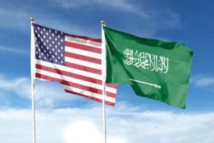 American flag and Saudi Arabia flag on cloudy sky. waving in the sky