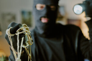 Jewelry in Thiefs Hand