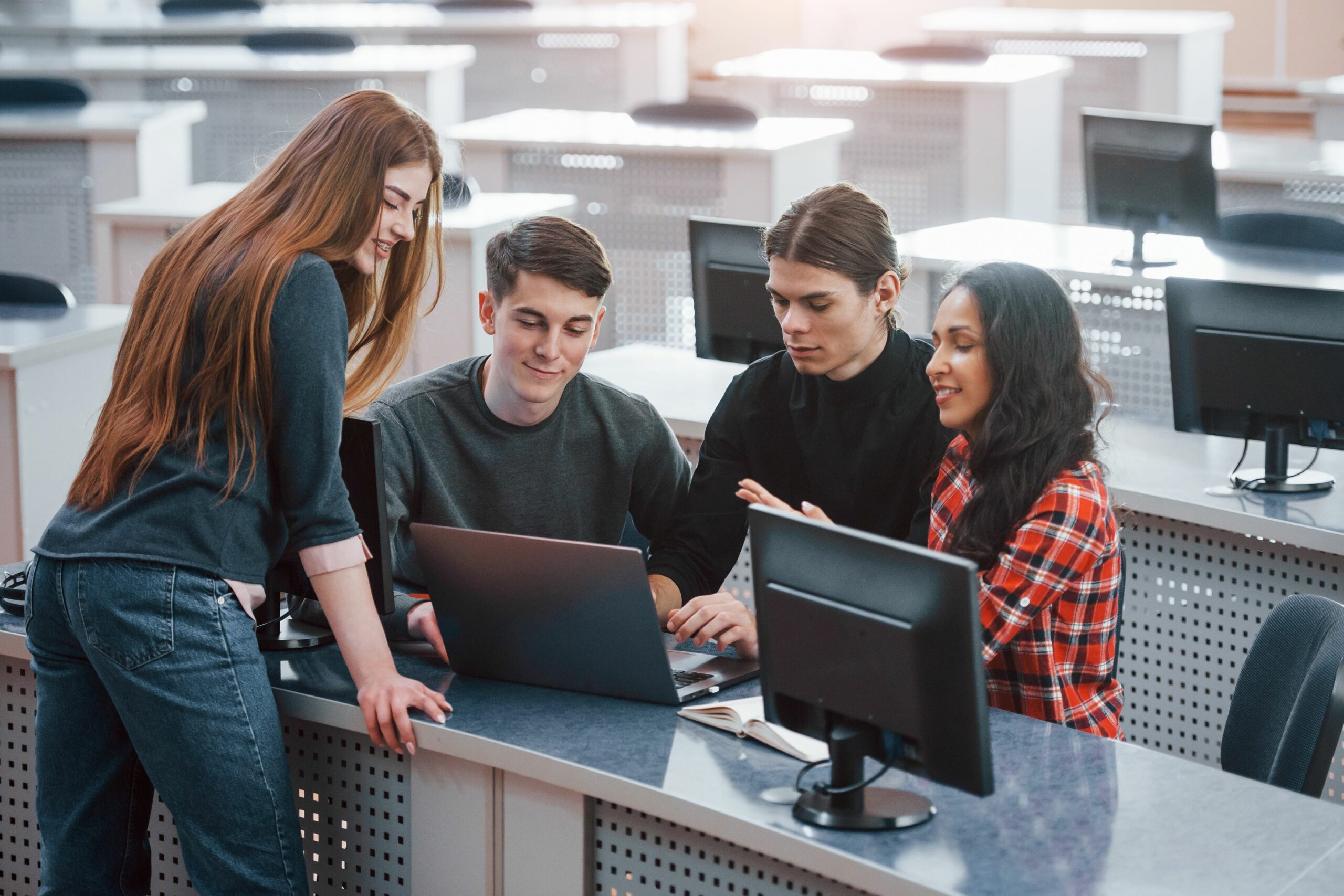Active conversation. Group of young people in casual clothes working in the modern office
