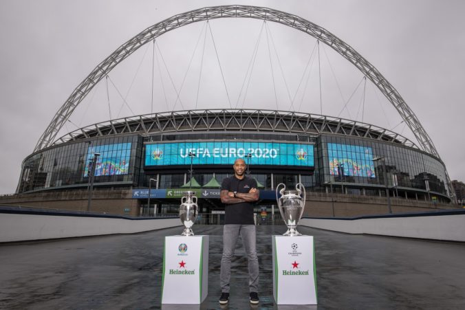 92026_henry with euro and ucl trophy with wembley arch backdrop 2 676x451.jpg