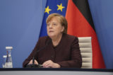 German Chancellor Angela Merkel speaks at the Chancellery in Berlin, Germany, Tuesday, Jan. 26, 2021 during an online conference at the Davos Agenda. The Davos Agenda from Jan. 25 to Jan. 29, 2021 is an online edition due to the coronavirus disease (COVID-19) outbreak. The global effort in the fight against the coronavirus pandemic is among the major topics facing the Davos forum this year.