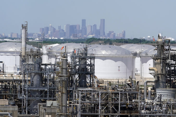EU Climate Methane FILE - In this Thursday, April 30, 2020, photo storage tanks at a refinery along the Houston Ship Channel are seen with downtown Houston, USA, in the background. The International Energy Agency said Wednesday that emissions of planet warming methane from oil, gas and coal production are significantly higher than governments claims. The countries with the highest emissions are China, Russia, the United States, Iran and India, the IEA said. Emissions
