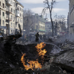 APTOPIX Russia Firefighters extinguish flames outside an apartment house after a Russian rocket attack in Kharkiv, Ukraine's second largest city Ukraine War