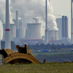 FILE - Steam comes out of the chimneys of the coal-fired power station Neurath near the RWE Garzweiler open-cast coal mine in Luetzerath, Germany, Monday, Oct.25, 2021. German energy giant RWE says it will phase out the burning of coal by 2030, saving 280 million metric tons of climate-changing greenhouse gas emissions. The decision announced Tuesday will accelerate the closure of some of Europe’s most polluting power plants and a vast lignite strip mine in the west of the country